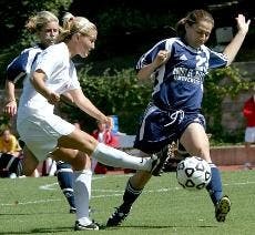 STRONG KICK - Freshman midfielder Brooke Sheppard uses all of her might to kick the ball away from her opponent. Strong kicks got the Eagles their 3-0 win against Holy Cross on Friday and 0-0 tie against Army on Sunday. The Eagles go on to play Bucknell S