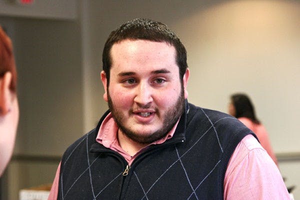 Suspended VP Alex Prescott meets with CAS Senator Victoria Glynn (cq) during a 10-minute recess of proceedings in the Kogod School of Business Building, March 28, 2010. Following the break, the senate voted 12-4-3 to remove him.