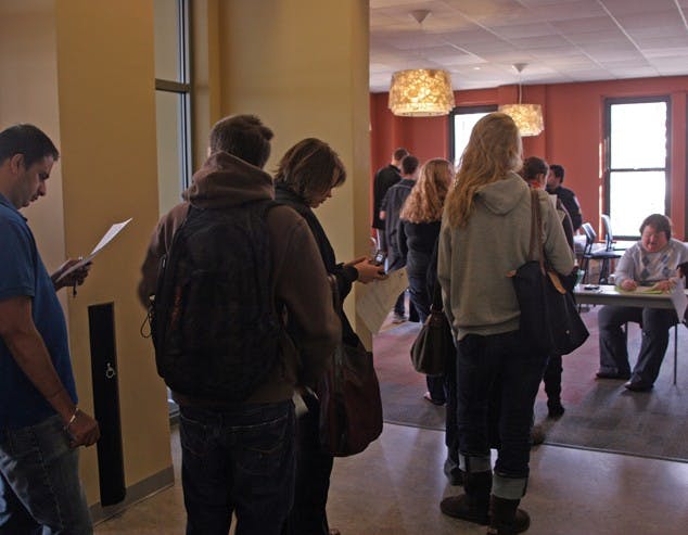 SWINE LINE â€” Members of the AU community wait for the swine flu vaccine at a clinic run by the Student Health Center on Dec. 1 in the Mary Graydon Center. The Health Center has vaccinated over 2,000 people in its two day-long clinics and plans to hold another clinic on campus within the next two weeks. 