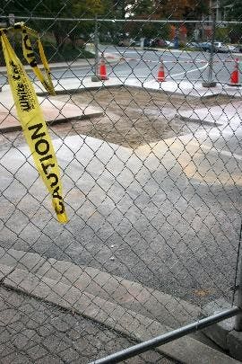 UNDER PRESSURE - A fence encloses the area where the pipe leak occurred. According to Friday's Today@AU, shuttle access through the Bender Pavilion tunnel will be averted until Tuesday. The new north side shuttle stop is across from the President's Buildi