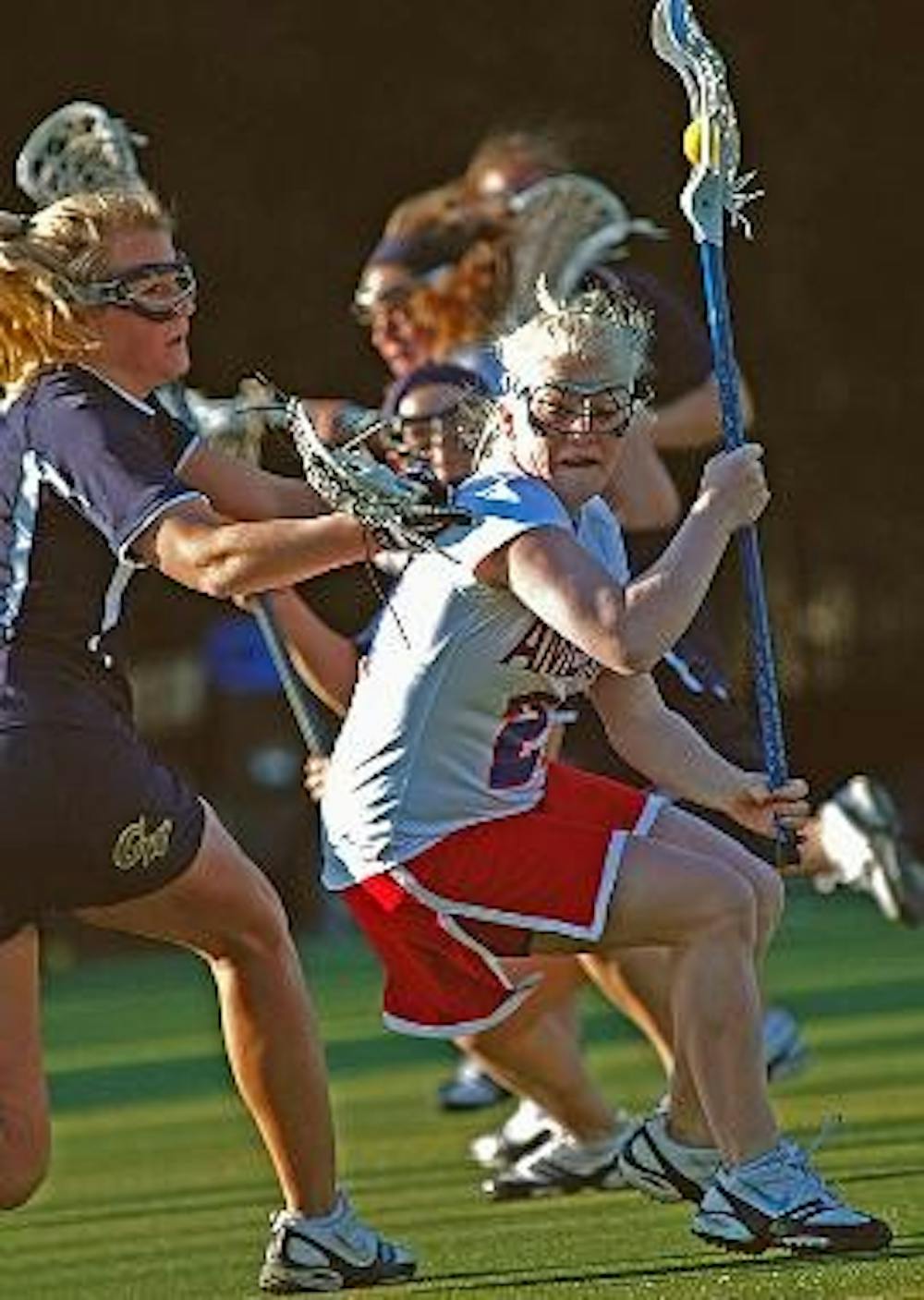GOAL - Freshman midfielder, Bernadette Maher (in white) attempts to get around a GW defender in a game earlier this season.  Maher scored two goals in AU's victory over Lafayette.