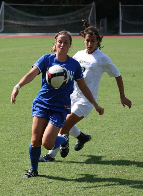 TAKING IT TO THE HOUSE--An AU forward takes a crossing pass to the net in their 2-1 win over Bryant University Sunday. It's the team's first OT win in more than a year, with Mikaila Weaver scoring the winning goal.