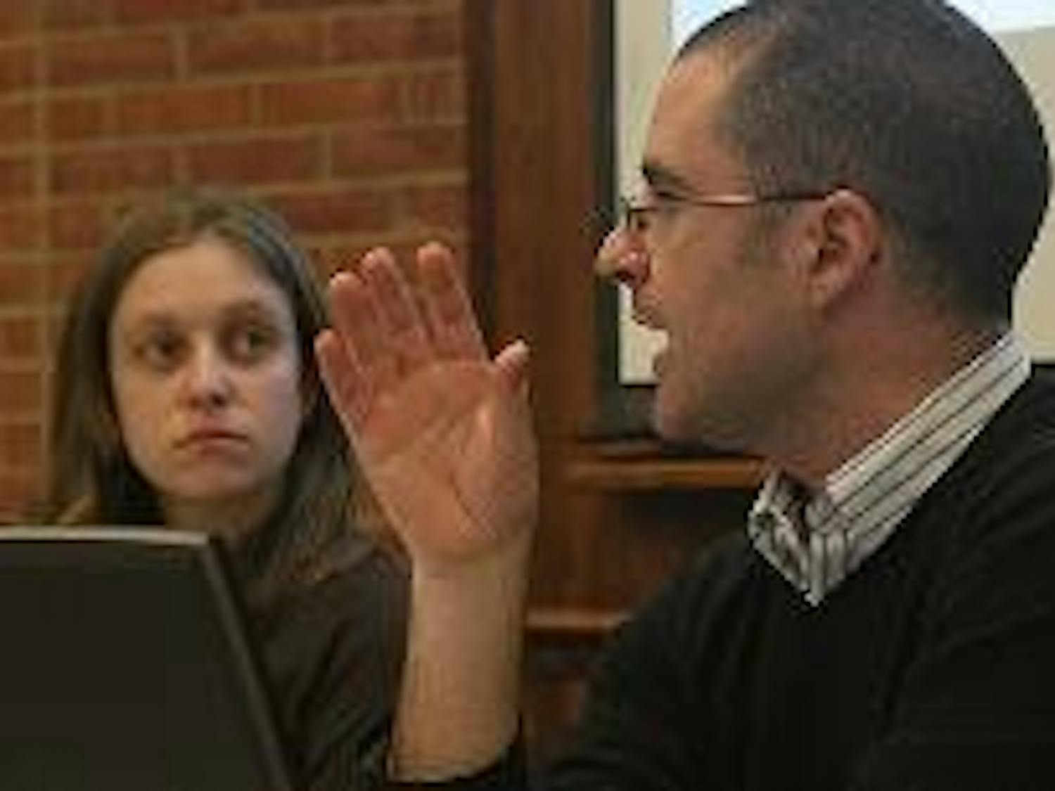 GOING GREEN - SIS instructor Simon Nicholson speaks at a panel discussion Thursday night to inform students of the new SIS building's designers' green plans. Nicholson, who is on the building committee for the new building, said it will be environmentally