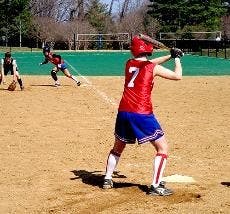 AU's Danyelle Halpern prepares to swing for the fences, while Stephanie Remar leads off first.