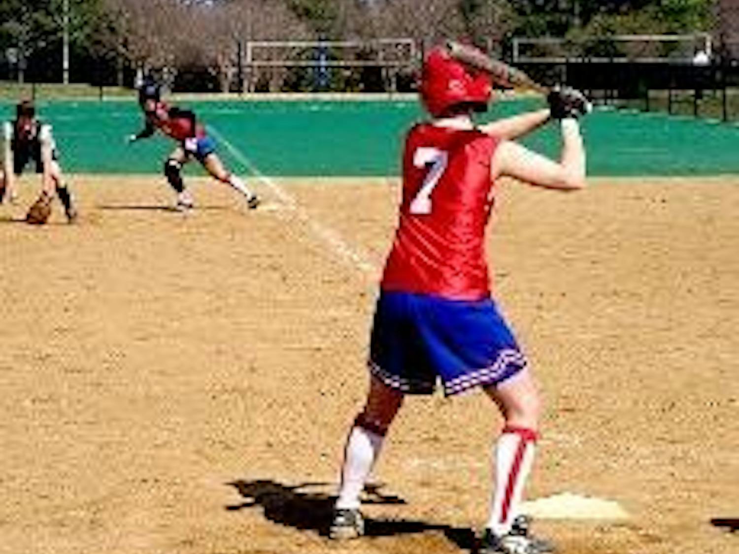 AU's Danyelle Halpern prepares to swing for the fences, while Stephanie Remar leads off first.
