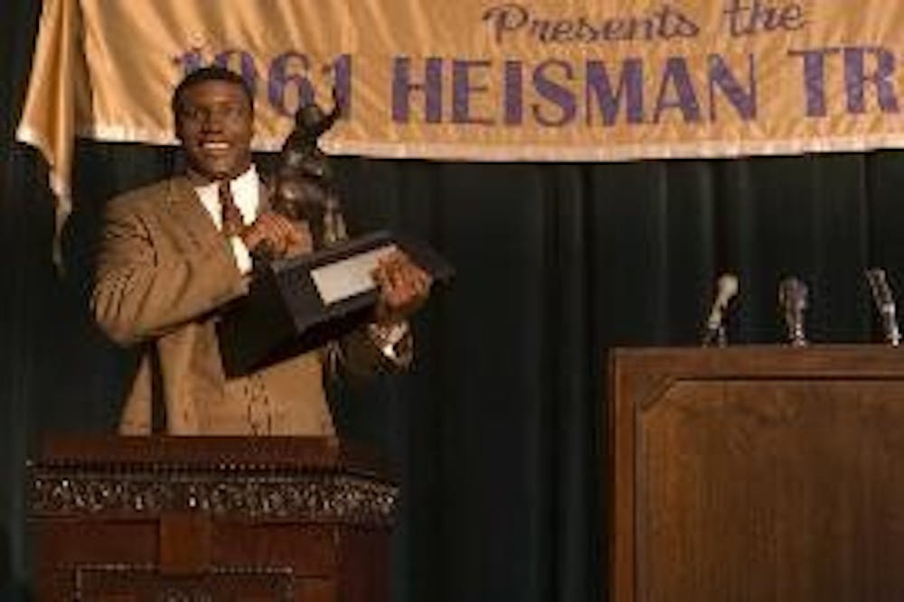 ROAD TO VICTORY - "The Express," directed by Gary Fledger, follows the life of the first black Heisman Trophy winner, Ernie Davis, played by Rob Brown.