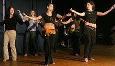 Rachel Kay Brookmire, right, teaches and performs belly dancing routines to students in the Tavern to promote Arabic culture.  