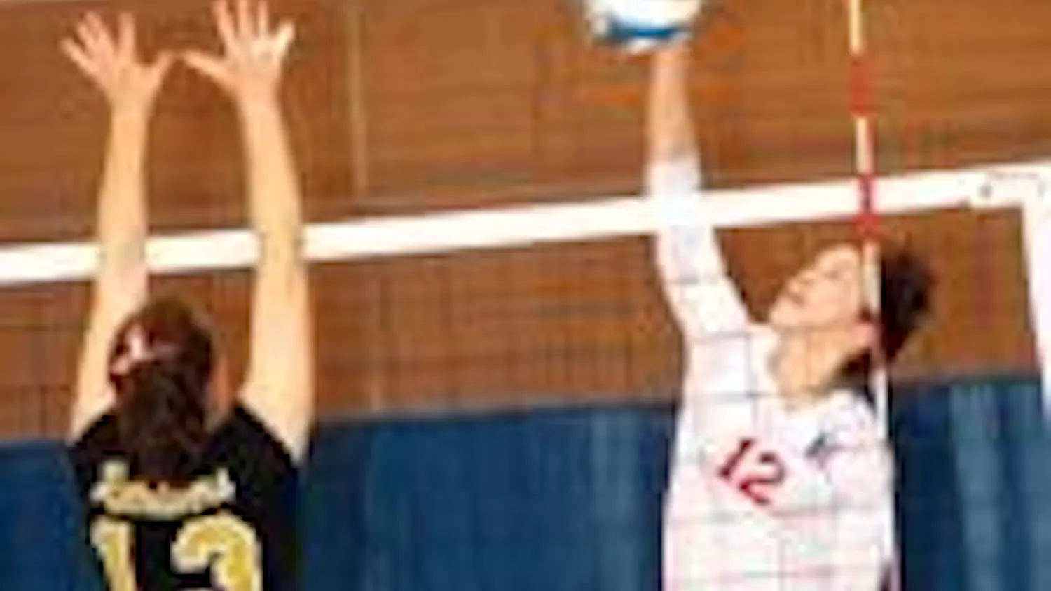 Senior Elizabeth Maloney helped American with three blocks in Friday's game.