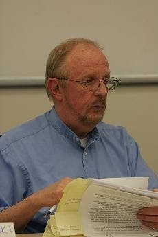 DIG IN - Charlie Bermpohl talks about the munitions dig at the discussion Tuesday night. More work is needed to remove a large burial site of unexploded World War I-era chemical weapons in the area. 