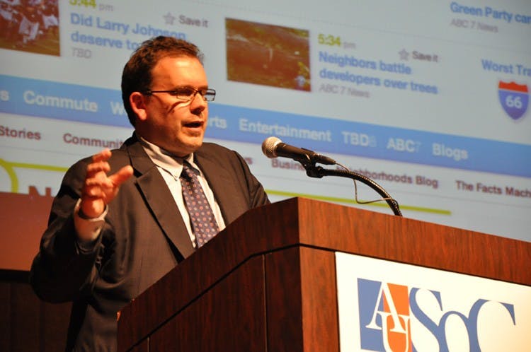 online alum â€”  TBD.com founder and 1989 AU alumnus Jim Brady speaks at Tuesdayâ€™s partnership kick-off in the Katzen Arts Center. TBD and AU will work together to host workshops for TBD employees and to offer students internships. Brady, the websiteâ€™s founder and general manager, is a former executive editor of washingtonpost.com.