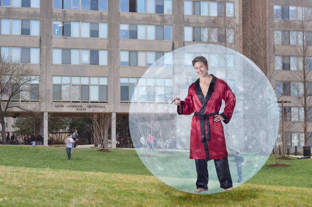 PROBLEM SOLVED â€” AU smokers looking to catch a smoking break wonâ€™t have to worry about other students giving them dirty looks anymore. Giant hampster balls will allow them freedom to move about the campus and protection from the elements. Here, a debonair AU student enjoys a break on the beach. 