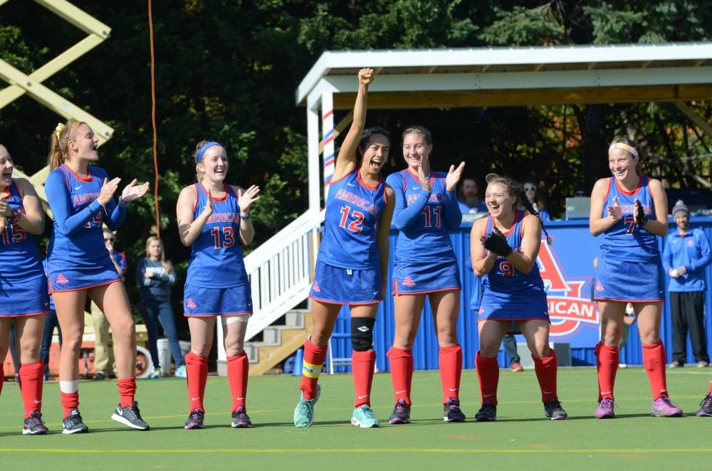 Emilie Ikeda, center, celebrates with her teammates on senior day in fall 2015.&nbsp;