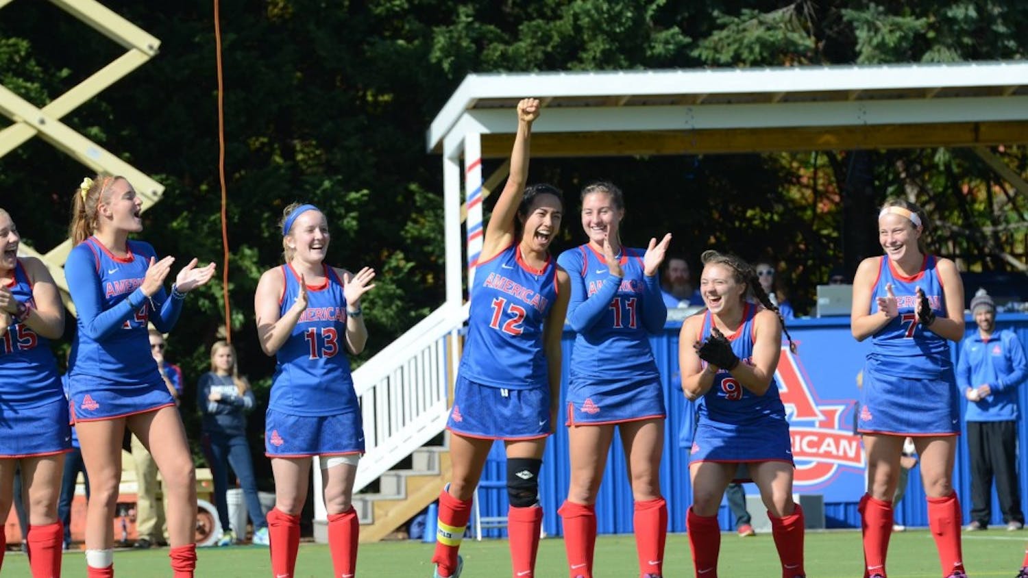Emilie Ikeda, center, celebrates with her teammates on senior day in fall 2015.&nbsp;