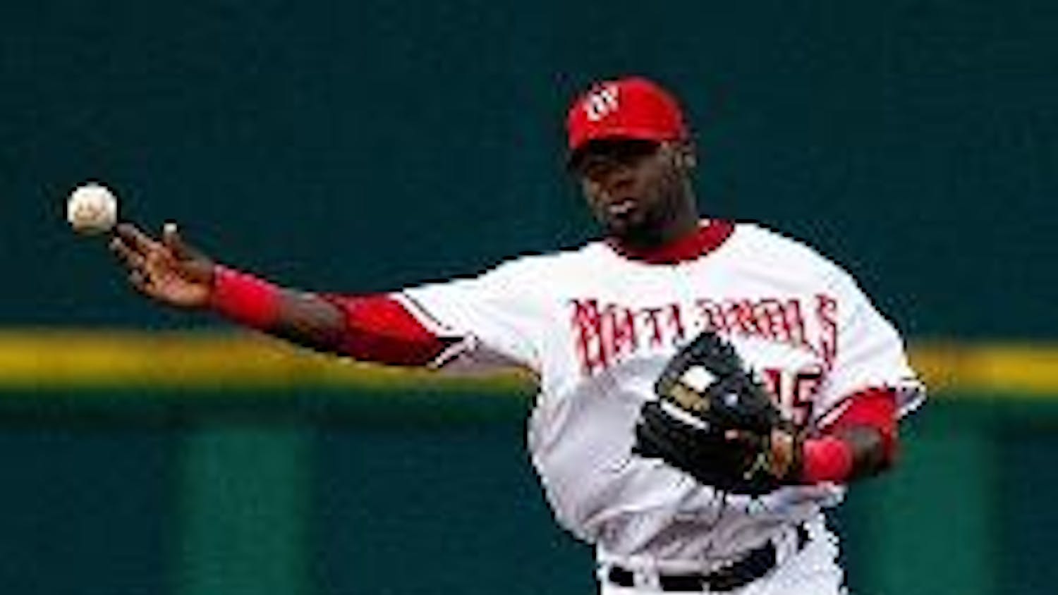 WHERE'S IT GOING? - Nationals short stop Christian Guzman tries to throw across the diamond to get the out at first. Only time will tell to see if his prediction on the Nats' end of season record is as accurate next fall.