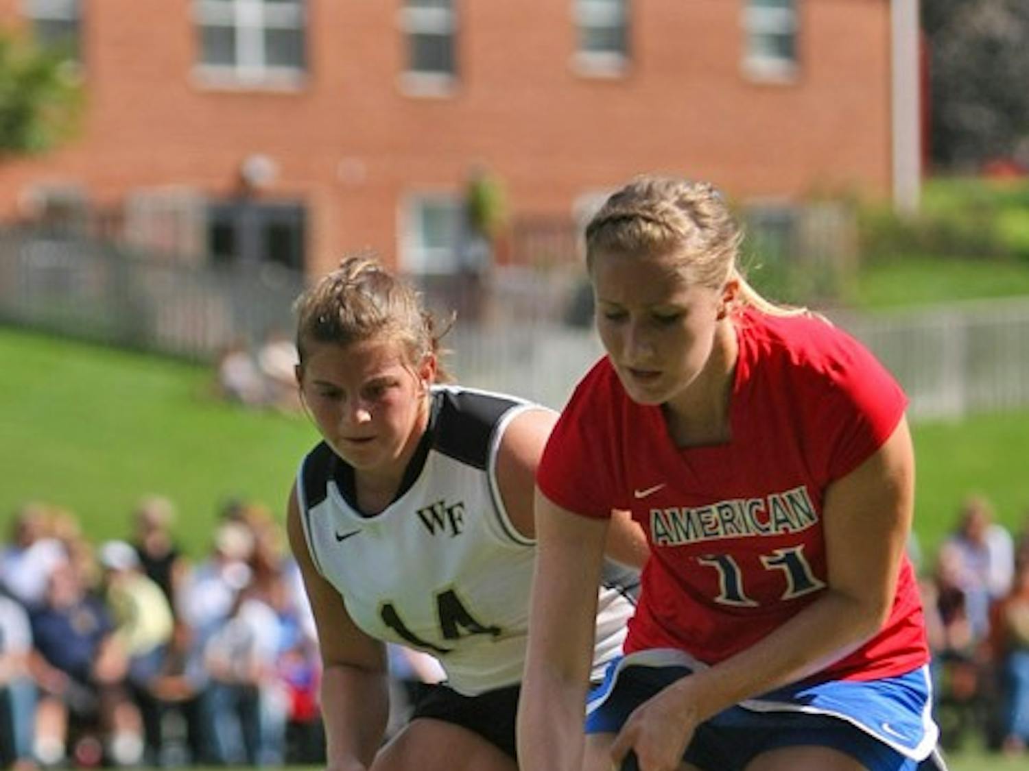 FAILING TO CAPITALIZE — AU freshman Kelsey Davis fights for a ball with a Wake Forest defender in their 1-0 loss on Sunday. Despite having a shot advantage, AU was unable to capitalize on several scoring chances. The Demon Deacons weren’t so careless with their chances, scoring on a penalty corner in the second half.