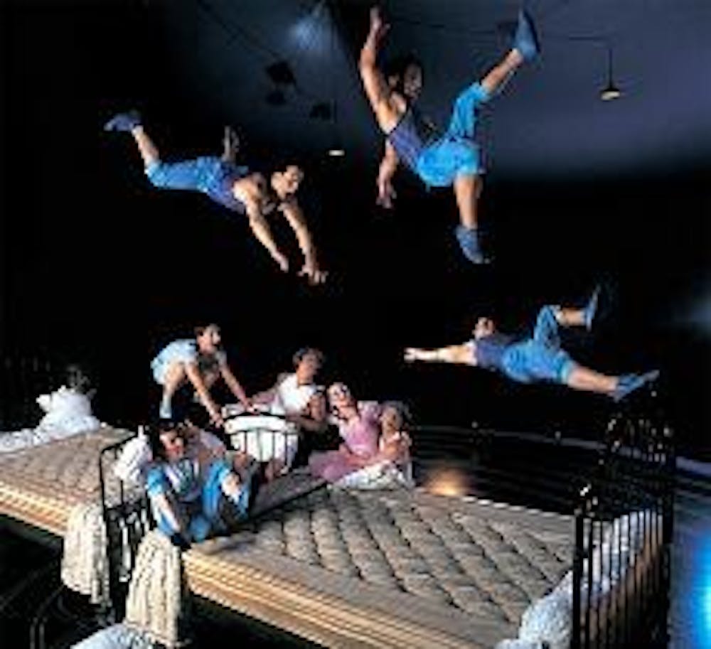 Acrobats bounce on giant beds during the D.C. engagement of 'Corteo.'