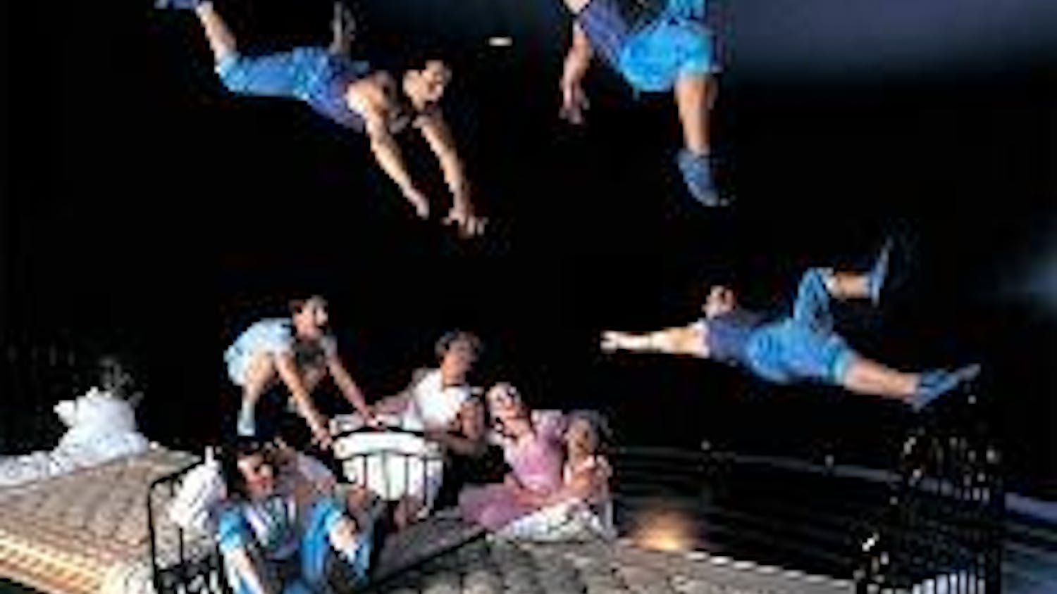 Acrobats bounce on giant beds during the D.C. engagement of 'Corteo.'