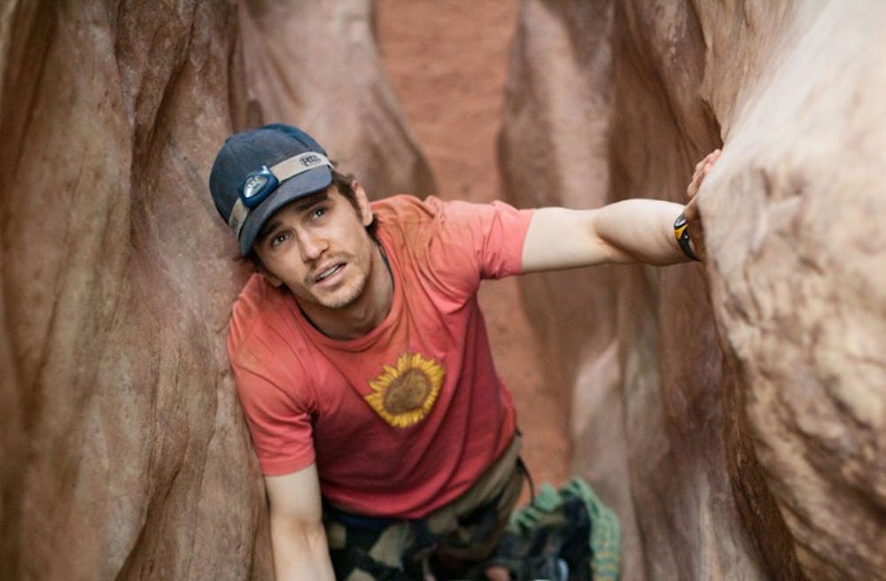BETWEEN A ROCK AND A HARD PLACE â€” The latest drama directed by Danny Boyle, â€œ127 Hours,â€ follows Aron Ralston (James Franco) as he finds himself trapped in a canyon. 