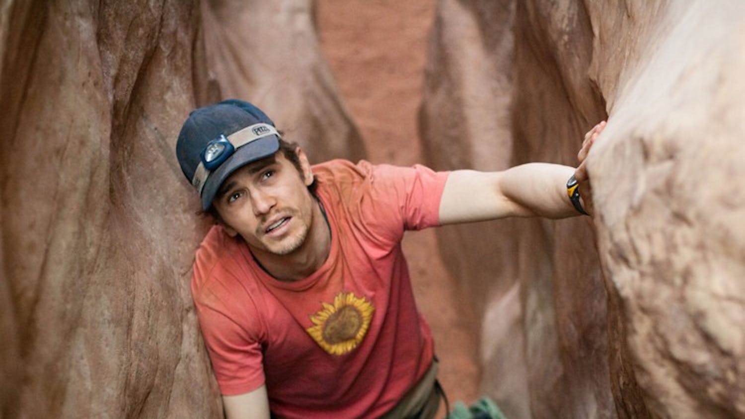 BETWEEN A ROCK AND A HARD PLACE â€” The latest drama directed by Danny Boyle, â€œ127 Hours,â€ follows Aron Ralston (James Franco) as he finds himself trapped in a canyon. 