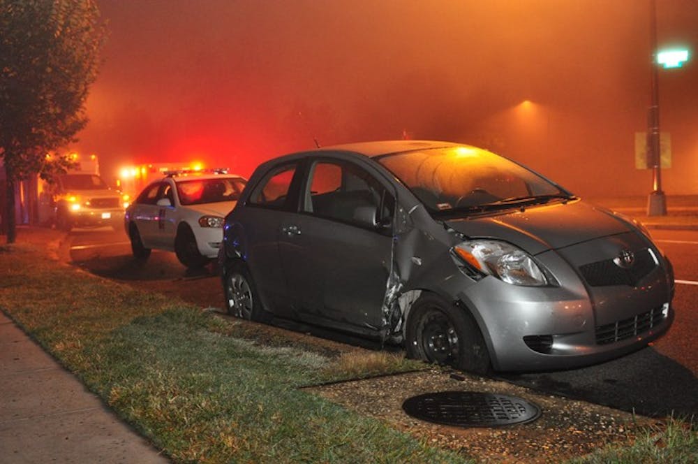 A Toyota Yaris, right and foreground, and an AU shuttle, left and background, collided at around 11:20 p.m. on Oct. 2. 