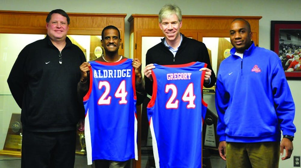 STARS OFF THE COURT â€” AU alumni David Aldridge, left, and David Gregory received honorary jerseys from AU. The two stopped by for a tapping of the â€œJeff Jones Weekly Radio Show.â€