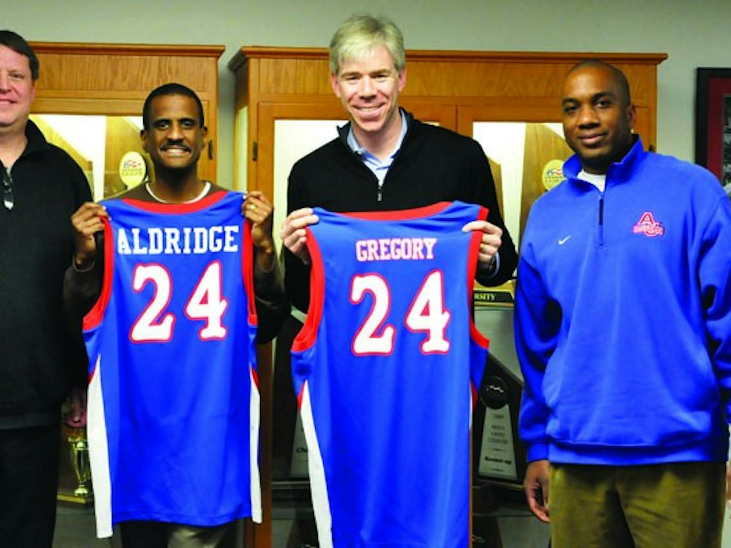 STARS OFF THE COURT — AU alumni David Aldridge, left, and David Gregory received honorary jerseys from AU. The two stopped by for a tapping of the “Jeff Jones Weekly Radio Show.â€
