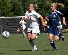 RACE FOR THE BALL- Krystn Hodge outruns her opponent to gain control of the game and go for a goal. Hodge scored two of the three Eagle goals in Tuesday's game against the George Mason Patriots.