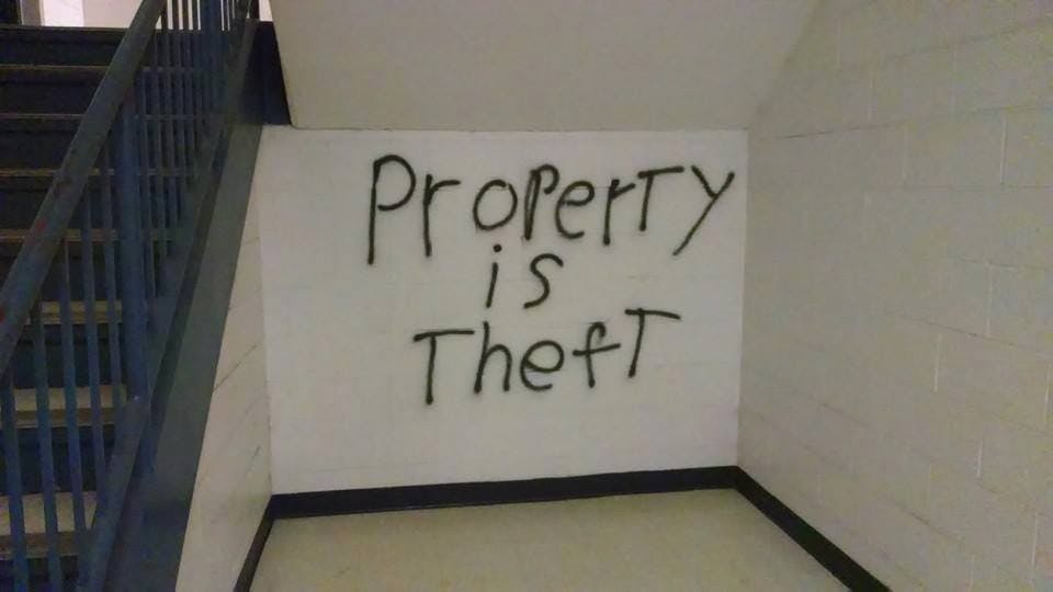 	The words “Property is Theft” was found painted near a staircase in the Ward Circle Building.