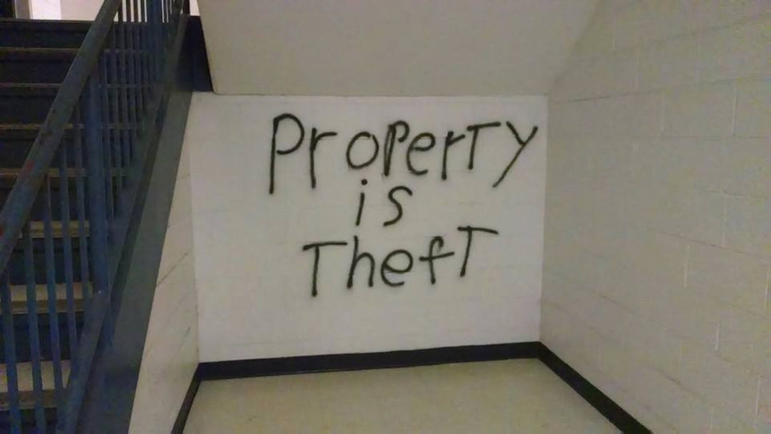 	The words &#8220;Property is Theft&#8221; was found painted near a staircase in the Ward Circle Building.