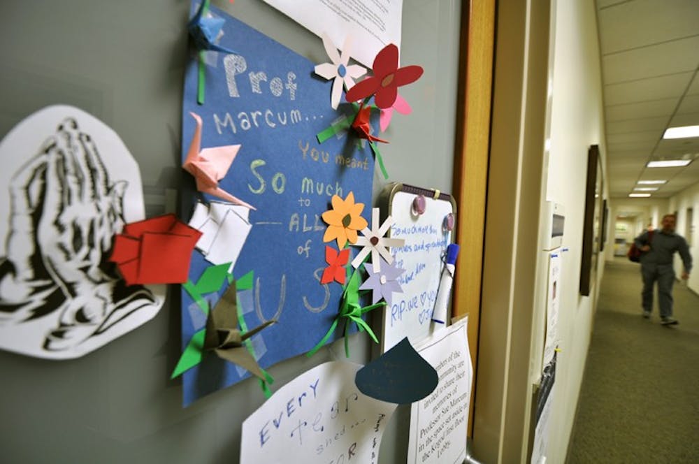 Notes are left on the door of the late Professor Sue Marcum.