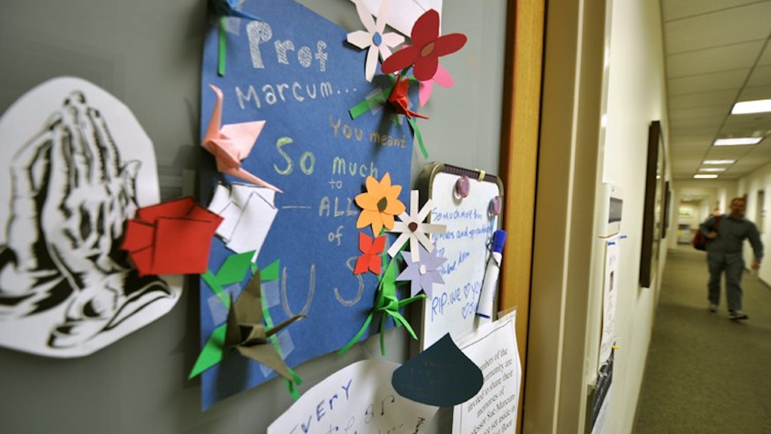 Notes are left on the door of the late Professor Sue Marcum.