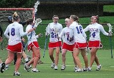GOAL - The Eagles' offense celebrates one of Bernadette Maher's three goals.  Despite Maher's three goal performance and the Eagles' 12 total goals, the team was no match for the rain and 16 goals from the University of Richmond Spiders. The Eagles play t