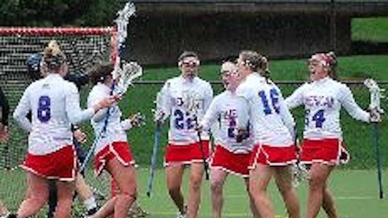 GOAL - The Eagles' offense celebrates one of Bernadette Maher's three goals.  Despite Maher's three goal performance and the Eagles' 12 total goals, the team was no match for the rain and 16 goals from the University of Richmond Spiders. The Eagles play t