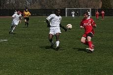 EYES ON THE BALL- Freshman defender Nick Kapus faces off against a Real Maryland team member in Saturday's exhibition game. The men's soccer team played two full exhibition games back to back Saturday afternoon on Reeves Field against both Georgetown and 
