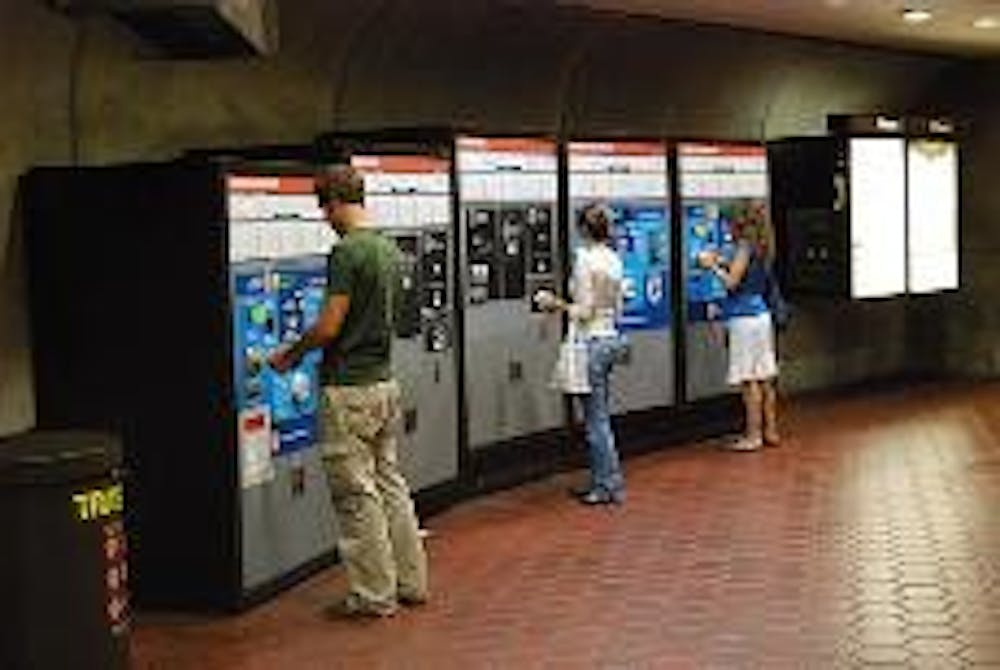 In this 2008 file photo, Metro riders purchase fares at the Tenleytown-AU station.