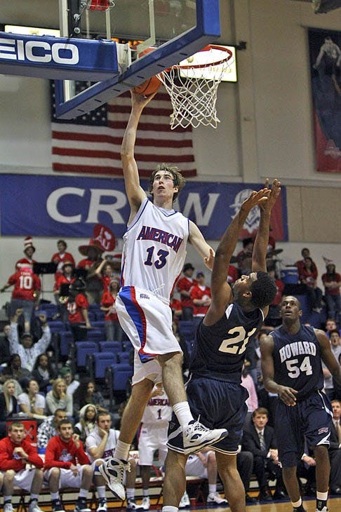 Sophomore Joe Hill (right) goes for a layup. AU won their first game 59-53 over the Bison.