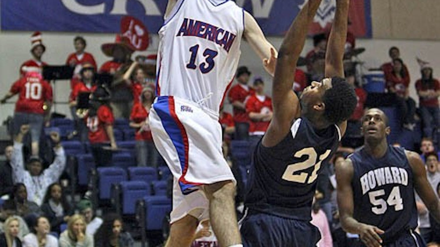 Sophomore Joe Hill (right) goes for a layup. AU won their first game 59-53 over the Bison.