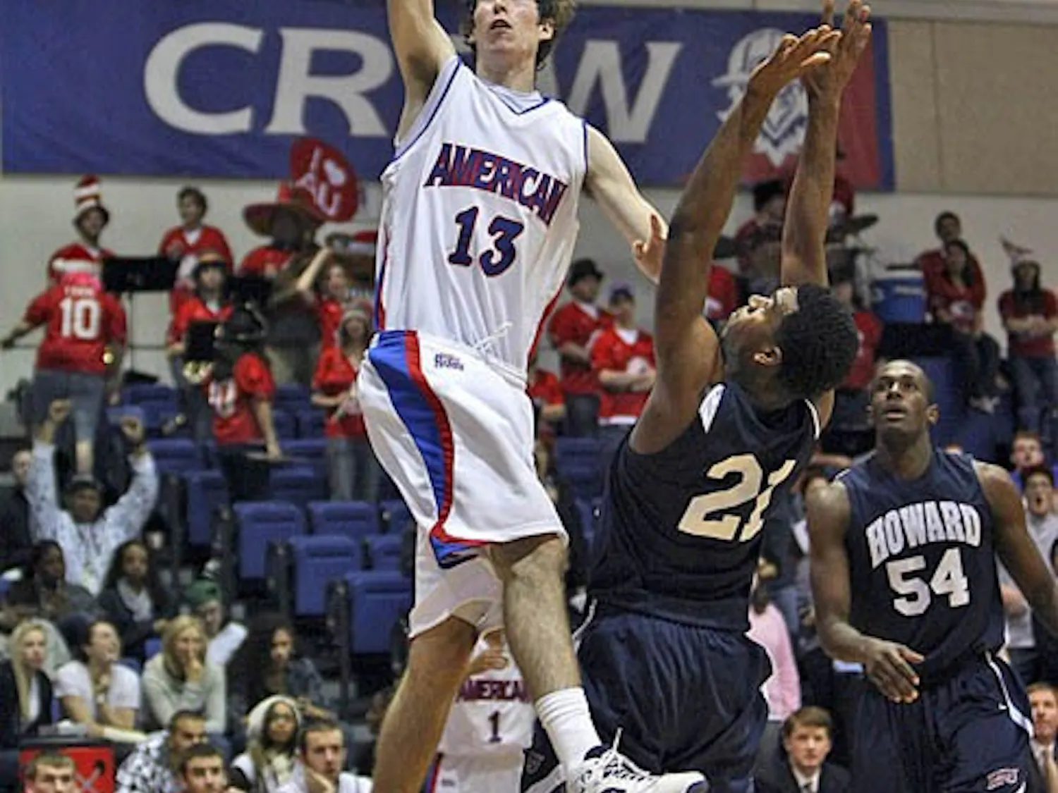 Sophomore Joe Hill (right) goes for a layup. AU won their first game 59-53 over the Bison.