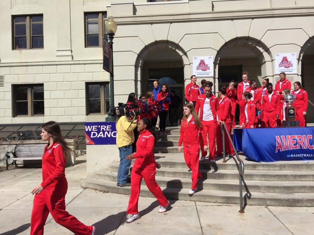 Members of the women's basketball team leave on March 18 to board a bus to the airport where they will fly to Iowa.