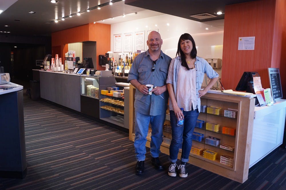 	Owner Josh Levin (left) and Director of Programming Renee Tsao (right) stand in the lobby of the West End Cinema. 