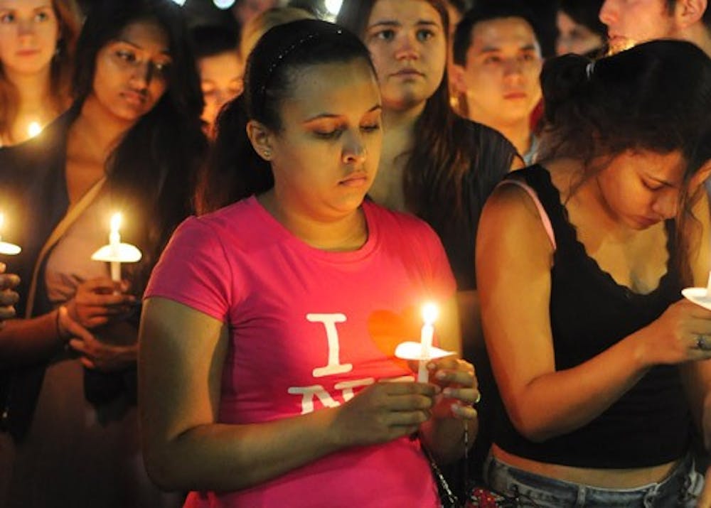 AU students gather on the quad for a candlelight vigil commemorating the 10th anniversary of the Sept. 11 attacks.