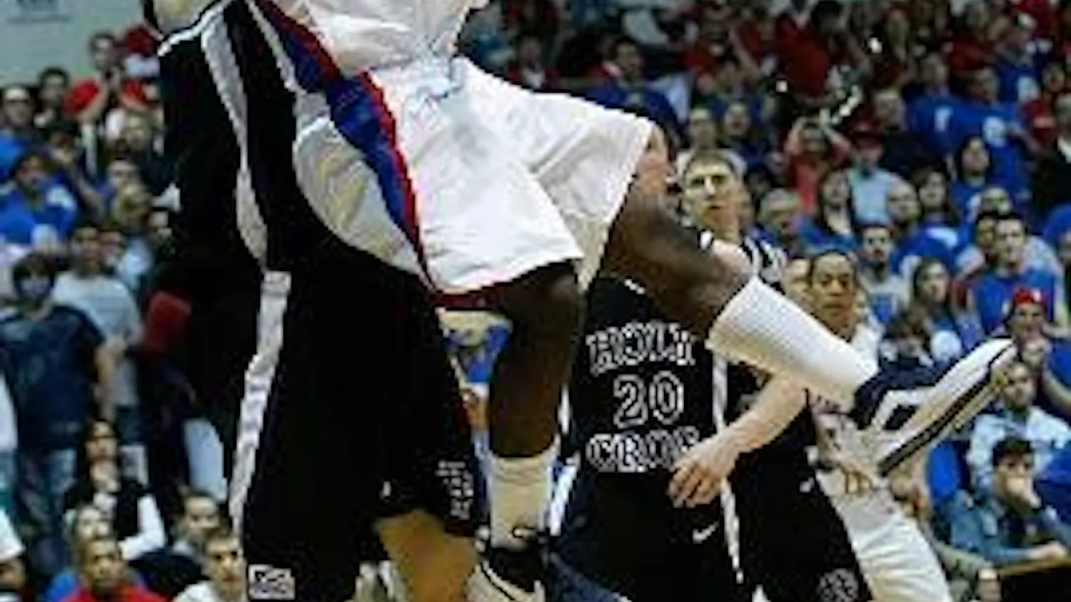LAY-IN - Senior point guard Derek Mercer goes up for a lay up against a College of the Holy Cross defender in the Eagles 56-50 win. Mercer finished the game with 11 points on 4-12 shooting. The Eagles are now 10-1 in Patriot League play and 18-7 overall.
