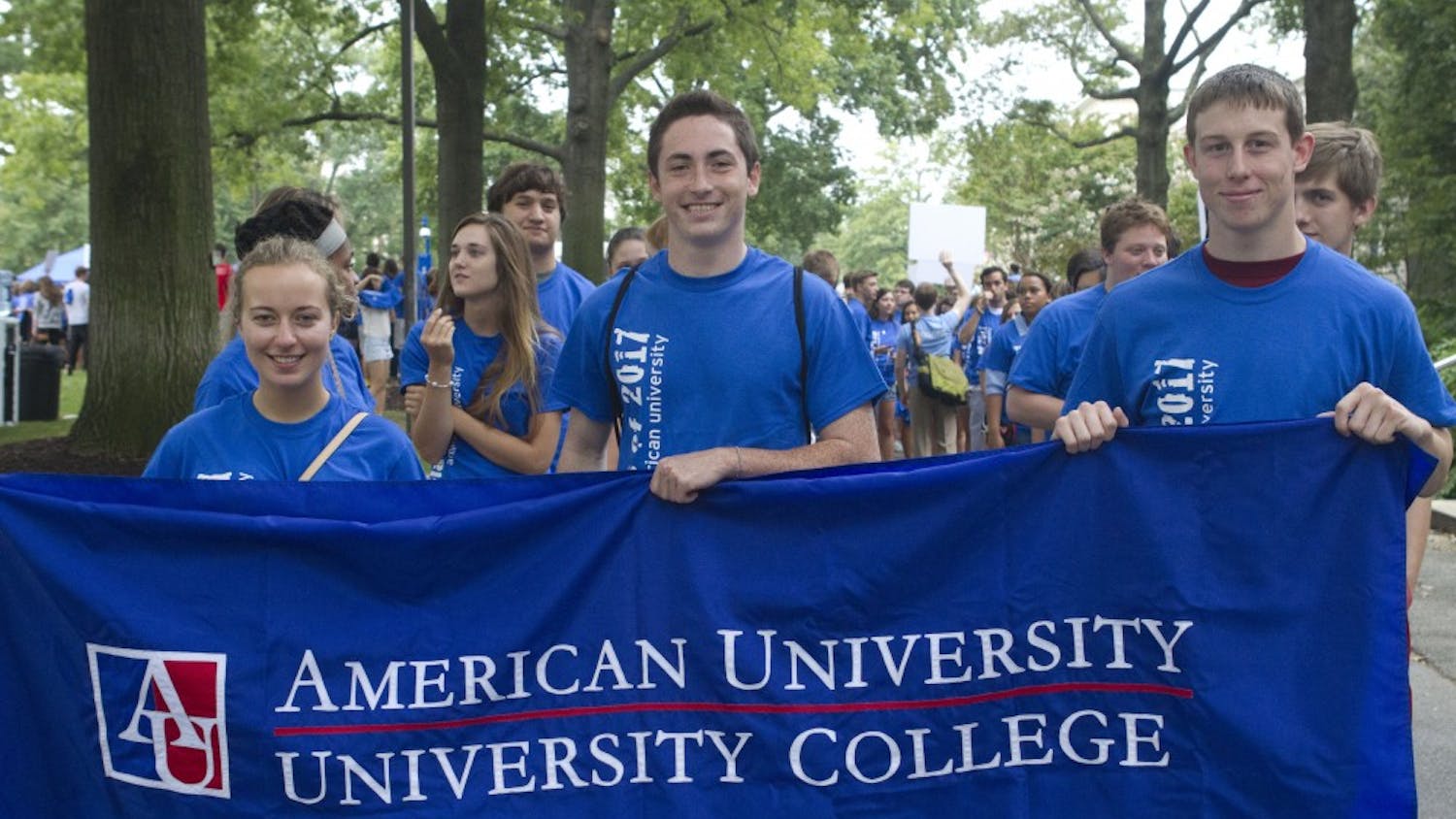 	University College students display a banner on the march to convocation.