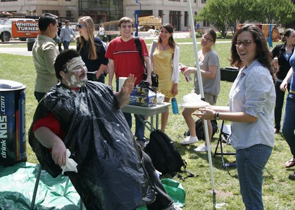 PIE TIME â€” Quinn Pregliasco, next yearâ€™s director of Womenâ€™s Initiative, pies Class of 2010 Senator Steve Dalton during this past weekâ€™s Spring Fling events. All proceeds of the pie-throwing benefitted the Clean Energy Revolving Fund.