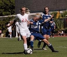 ATTACK - Junior Krystn Hodge attempts to steal the ball from her opponent. The Eagles had a bittersweet weekend, suffering a loss to Towson and gaining a win to Mount St. Mary's.