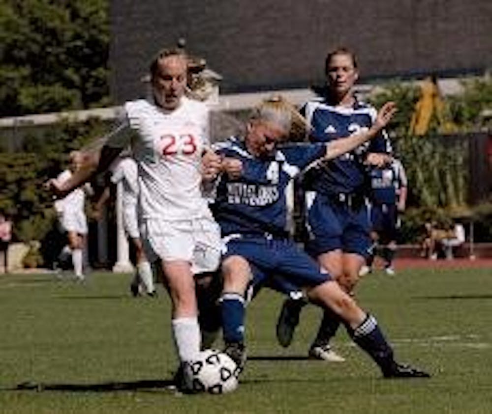 ATTACK - Junior Krystn Hodge attempts to steal the ball from her opponent. The Eagles had a bittersweet weekend, suffering a loss to Towson and gaining a win to Mount St. Mary's.