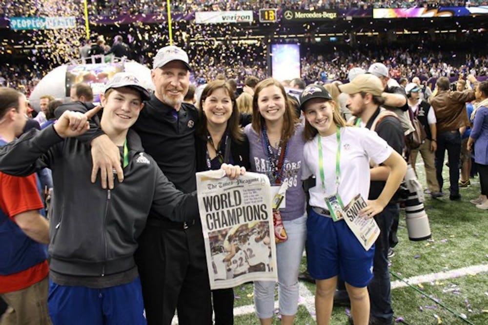 Megan Rosburg (second from right) celebrates on the field of the Superdome in New Orleans with her family, including her father and Ravens Assistant Head Coach Jerry Rosburg (second from left), after the Ravens beat the San Francisco 49ers in Super Bowl XLVII. 
