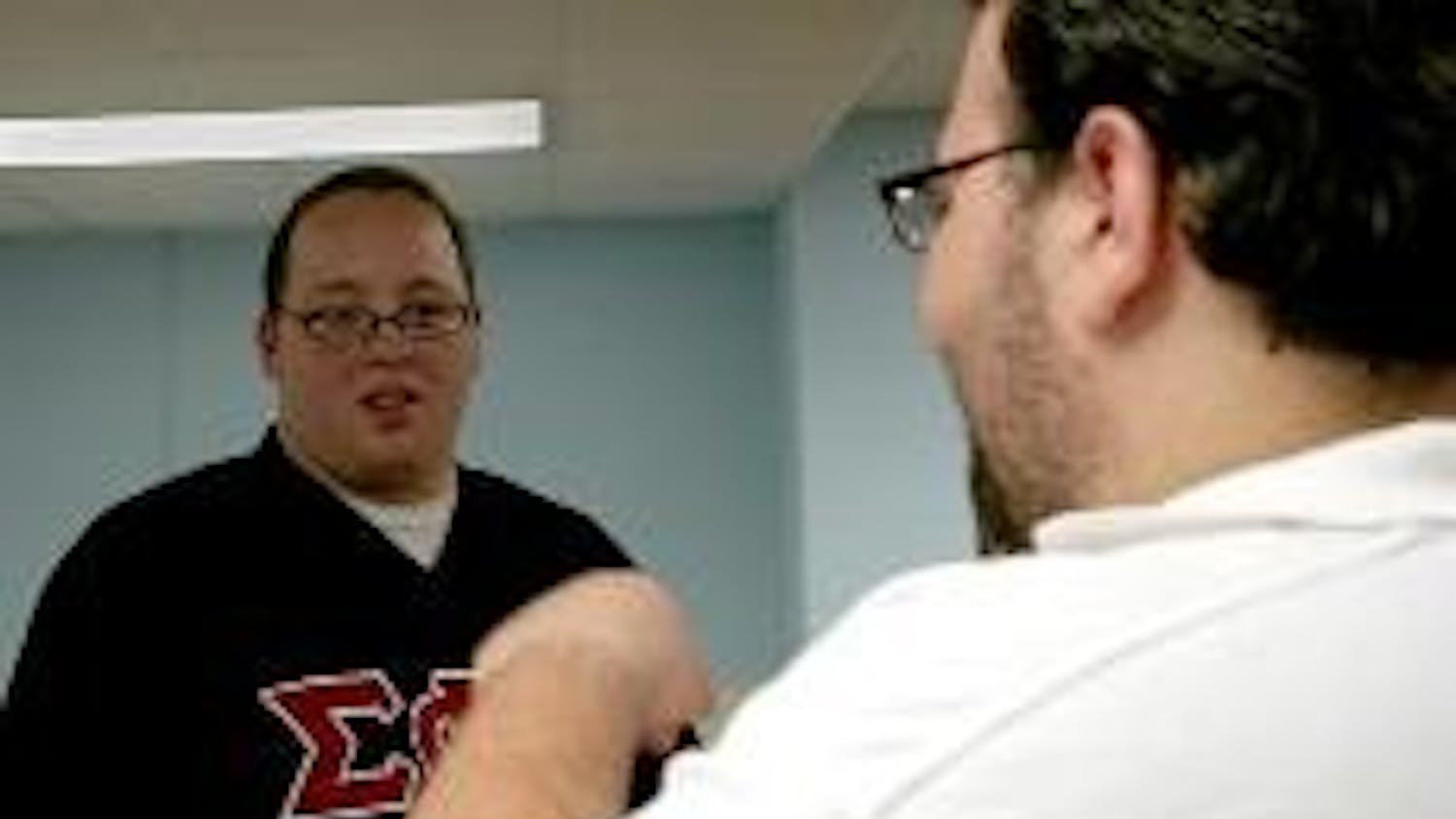 ANSWERING QUESTIONS-SG president Joe Vidulich meets with students in the Anderson Honors Lounge to discuss issues ranging from rising tuition to athletics. When asked about a student Bill of Rights at AU, Vidulich said one was "already in the works."