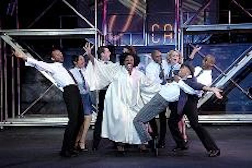 WHERE THERE'S SMOKE... - Aurelia Williams, pictured above performing "Saved," brings powerful vocals and infectious energy to the musical revue of Leiber and Stoller songs, "Smokey Joe's Caf&eacute;." Choreography in the style of "Fosse" tried to bring a 