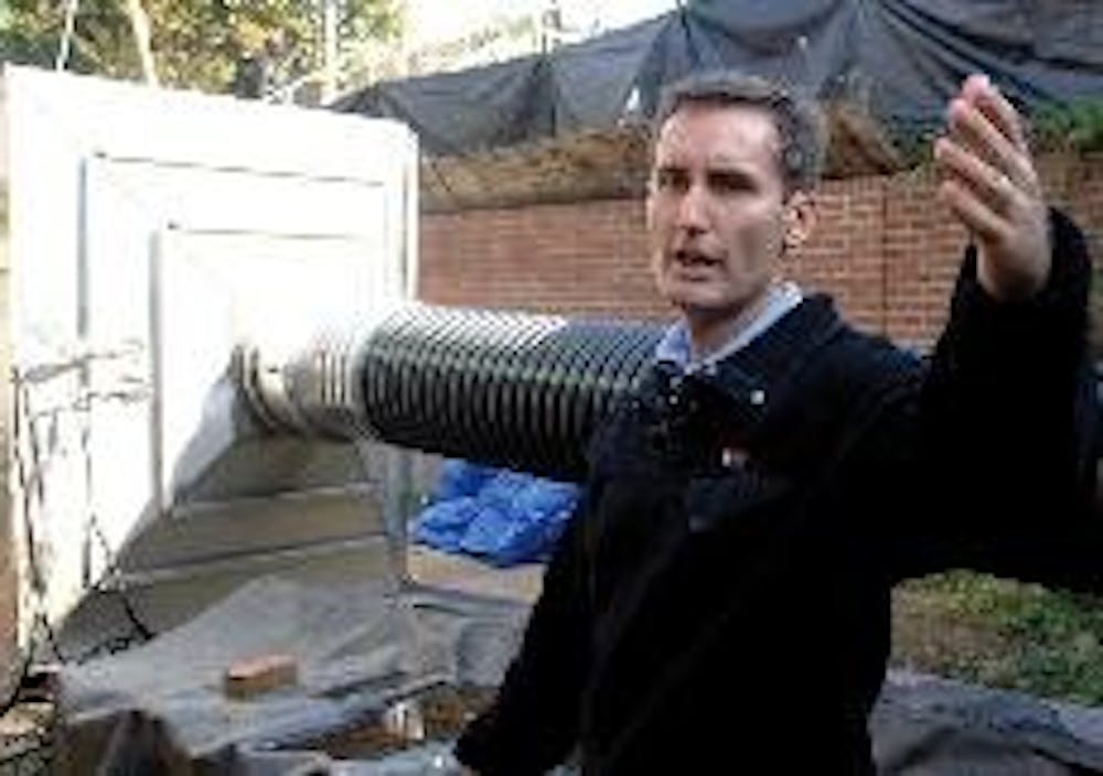 SAFETY FIRST - An official with the Army Corps of Engineers shows the chemical filtration network, which filters airflow into the Engineered Control Structure. The structure prevents the release of any harmful chemicals should an accident occur during the